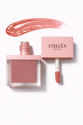 Lip gloss Stellea teinte Peach Pearl fini brillant hydratant, applicateur mousse.