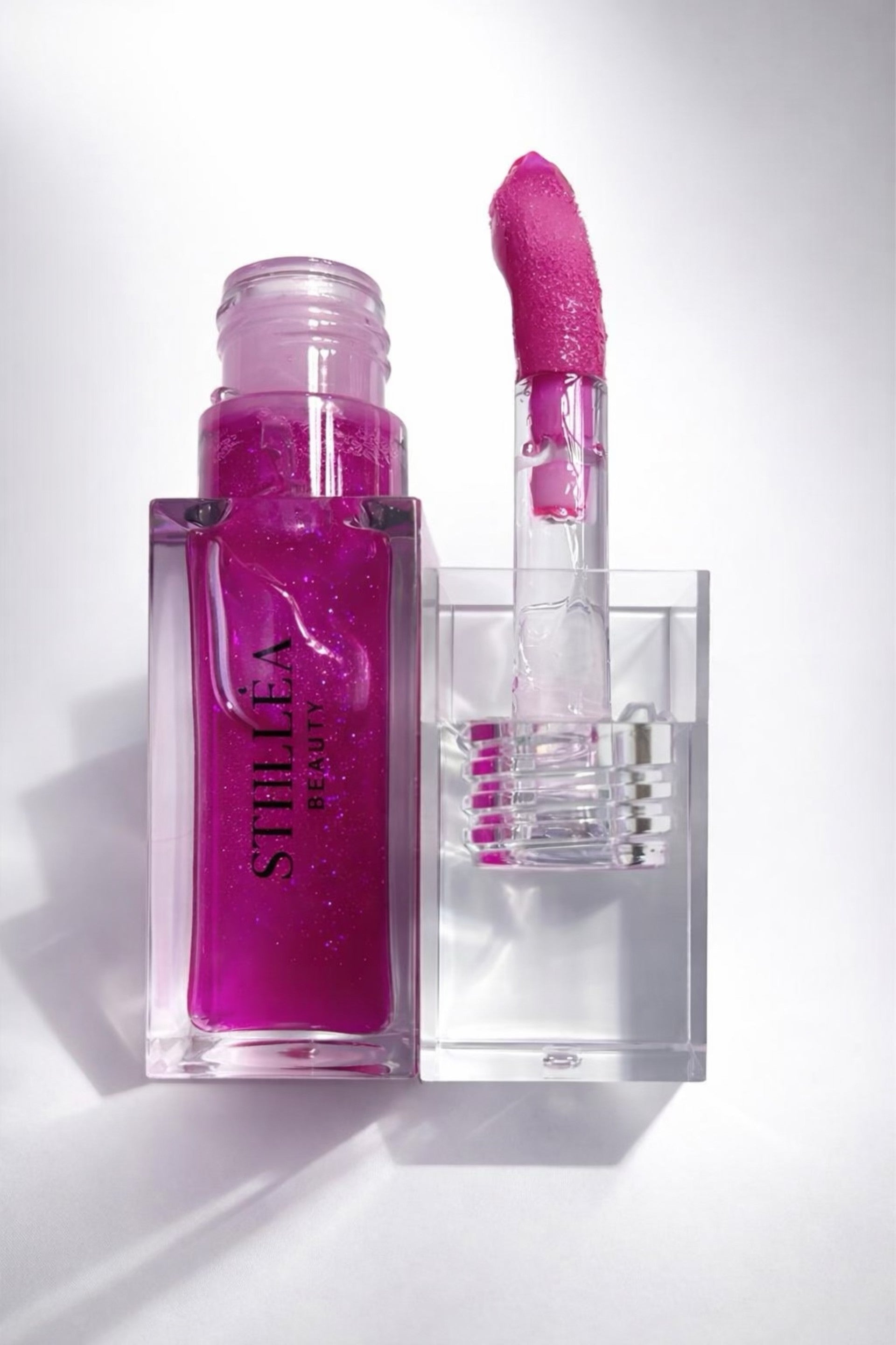 Huile à lèvres brillante STELLEA  Jupiter en flacon transparent avec texture  nourrissante effet glossy